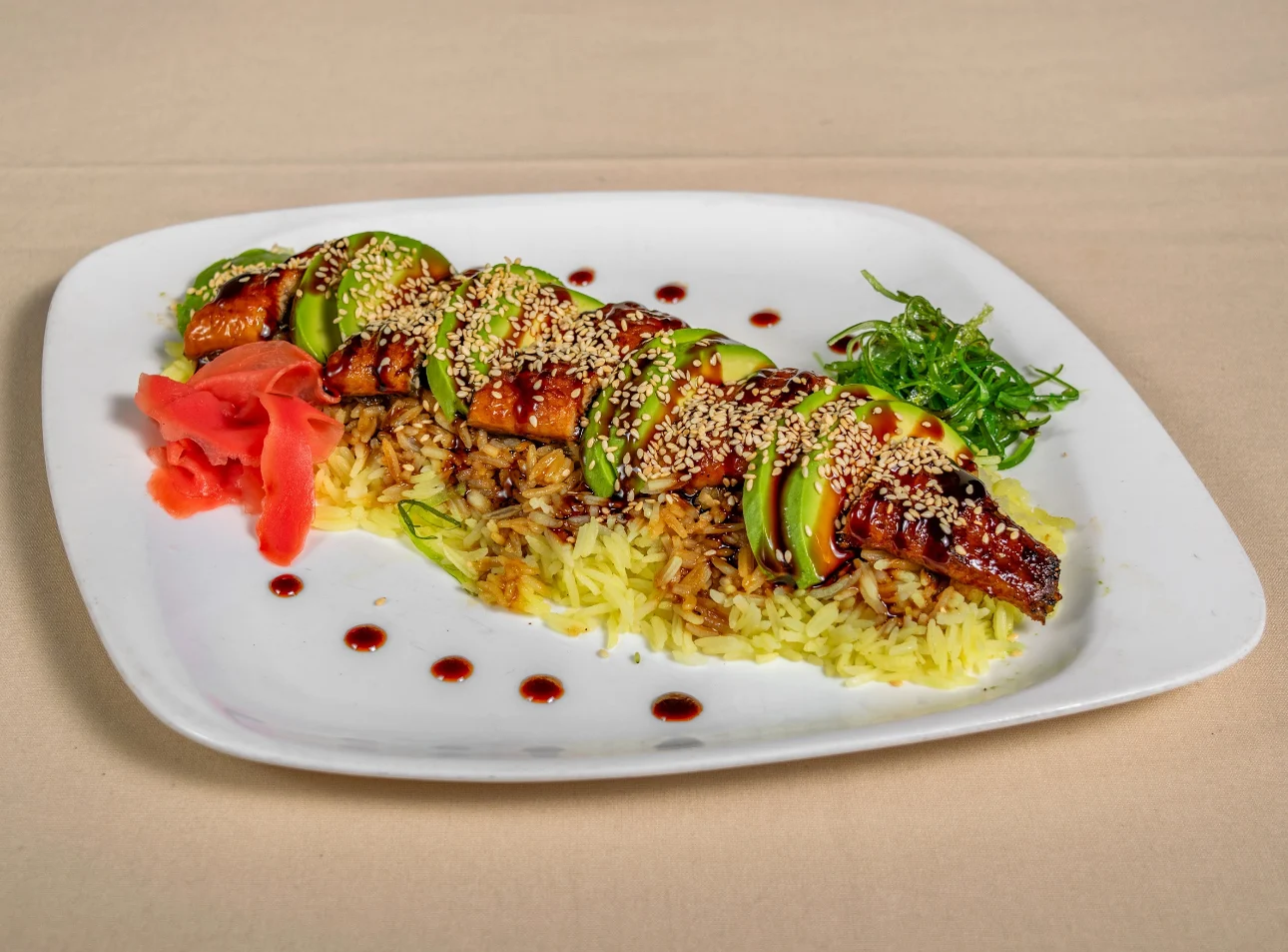 Grilled dish with sesame, avocado, and pickled ginger on a white plate at Chinar On The Island, South Beach.