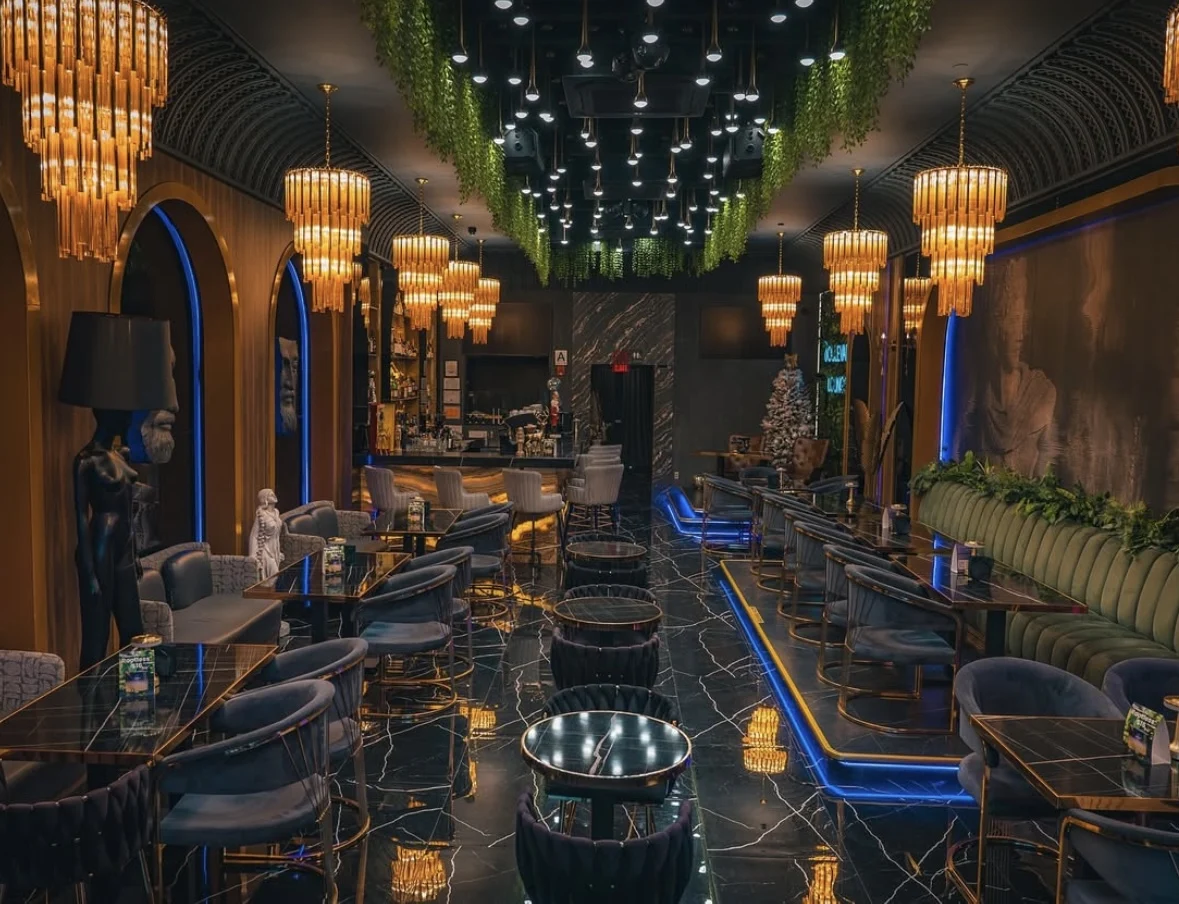 Boulevard Lounge featured image Interior of Boulevard Lounge, New Dorp, Bronx NYC with elegant lighting, greenery, and modern seating.