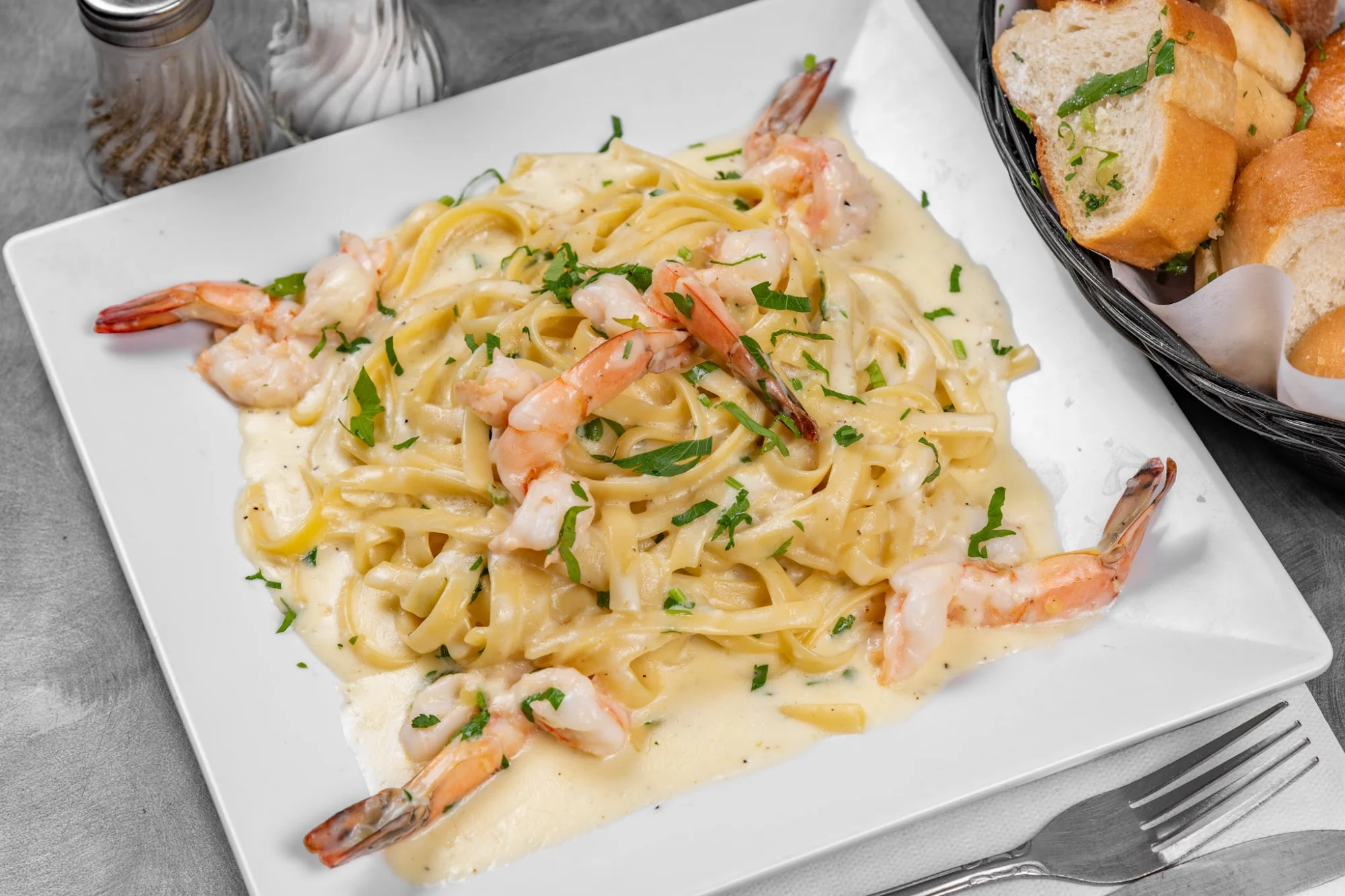 Fresca Pizza & Pasta featured image Plate of fettuccine with shrimp and creamy sauce at Fresca Pizza & Pasta, Mott Haven Bronx NYC.