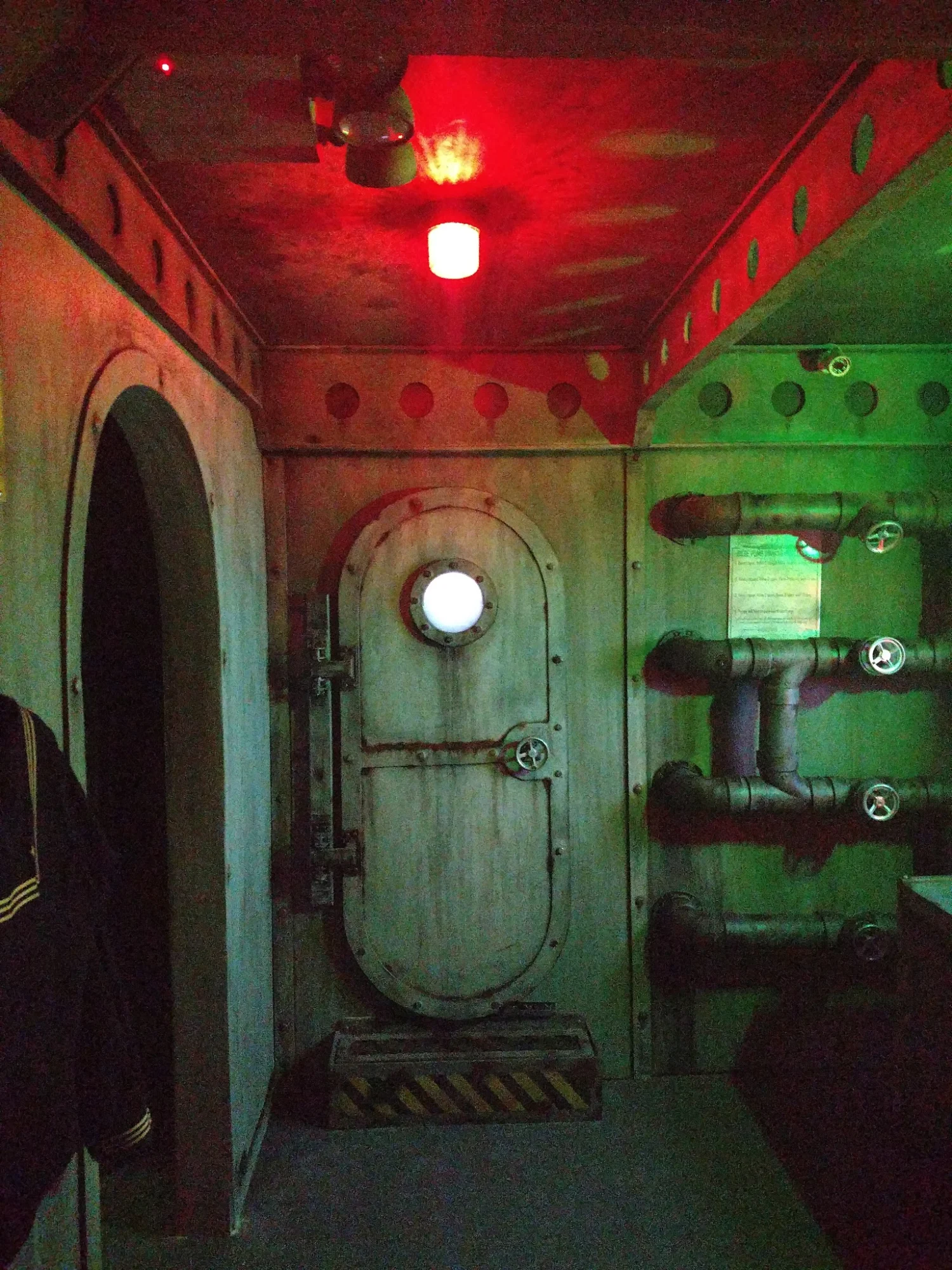 Unreal Escapes – Staten Island's Premiere Live Escape Room featured image Interior of Unreal Escapes with submarine-themed decor in Rossville, Bronx NYC.