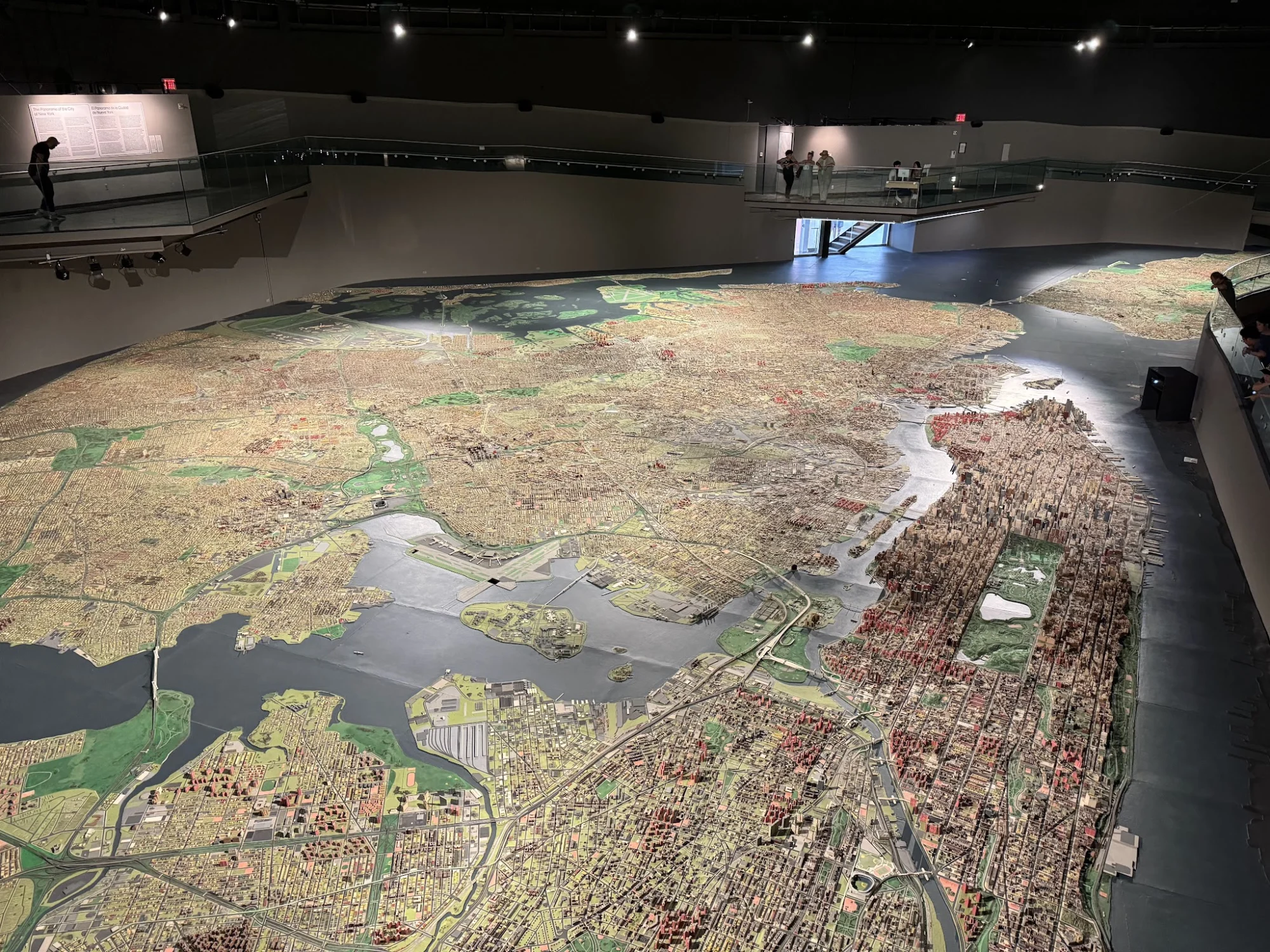 Wide view of a large scale model of New York City inside the Queens Museum in Corona.