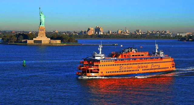 Staten Island Tours featured image Staten Island Ferry passing by the Statue of Liberty in St. George.