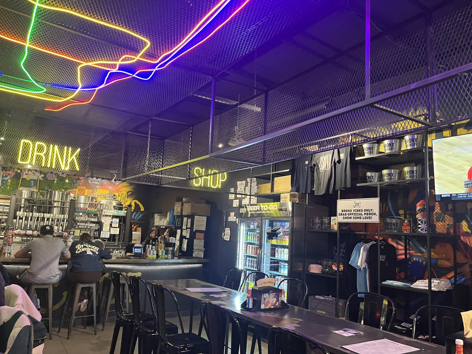 The Bronx Brewery & Hudson Yards Kitchen featured image Interior view of Bronx Brewery with neon lights and bar seating, Hudson Yards.