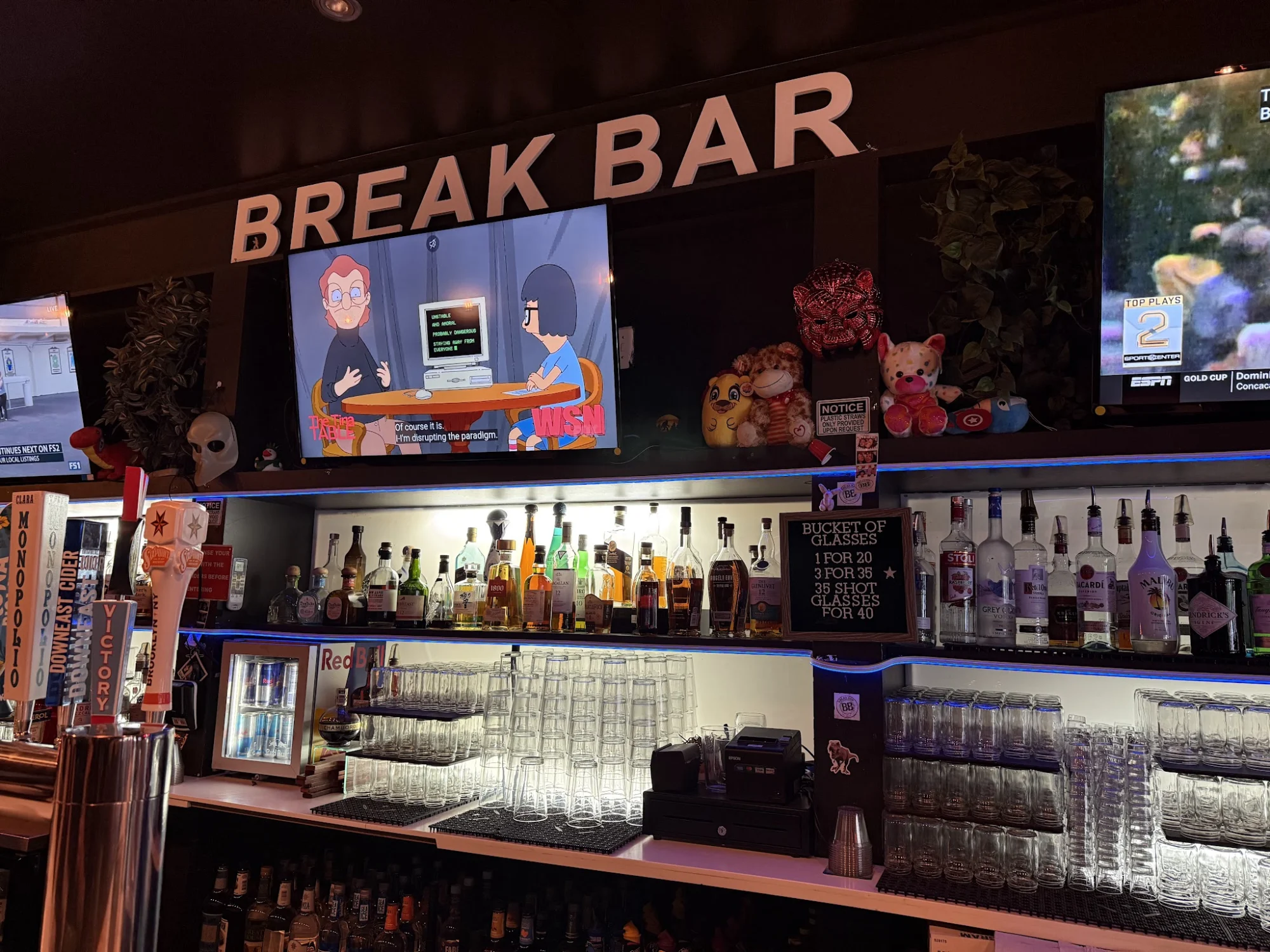 Break Bar interior with bottles and TV screens, Hell's Kitchen.