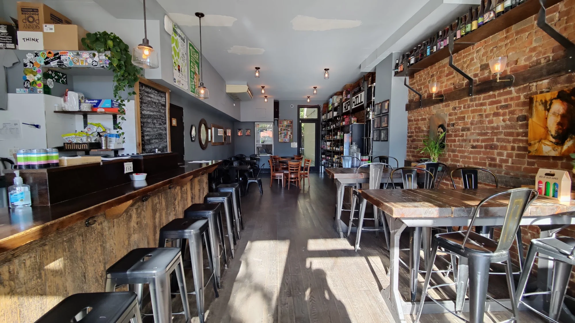 Hops Hill At Atlantic featured image Interior of Hops Hill At Atlantic, Boerum Hill, Bronx NYC with wooden bar, stools, and tables in a cozy setting.