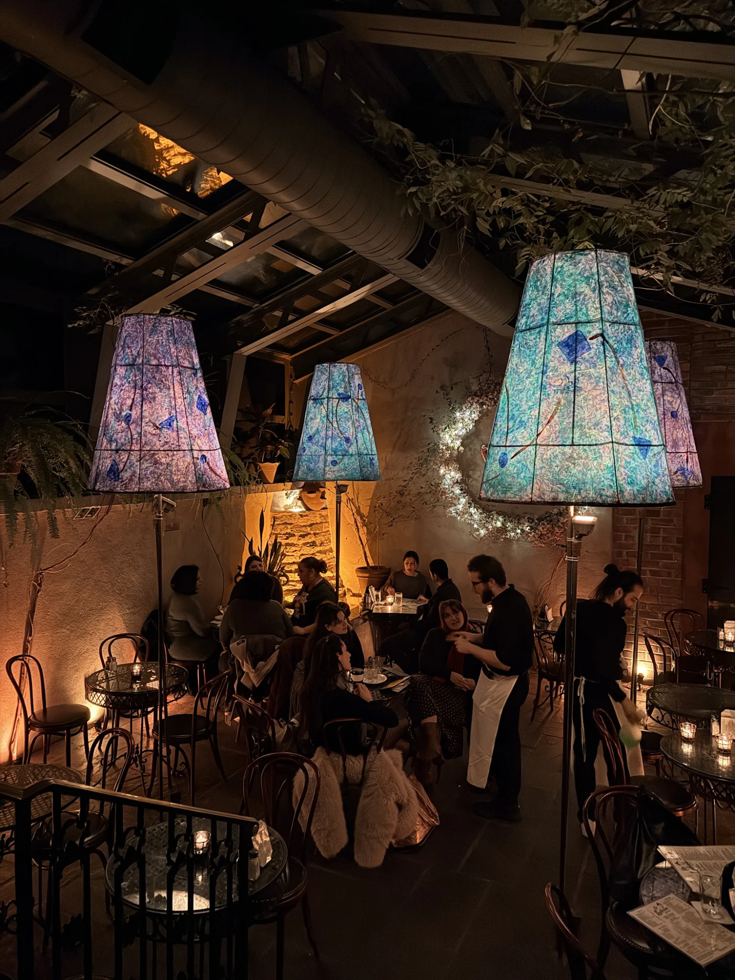 La Lanterna di Vittorio featured image Interior of La Lanterna di Vittorio in Greenwich Village with patrons seated under colorful lamps.