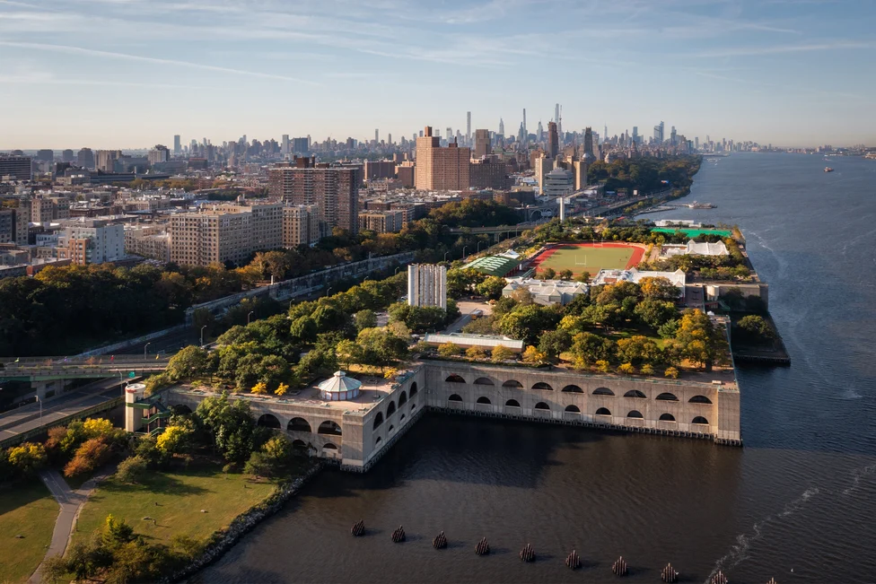 Aerial view of Riverbank State Park, Hamilton Heights, with surrounding river and city skyline.