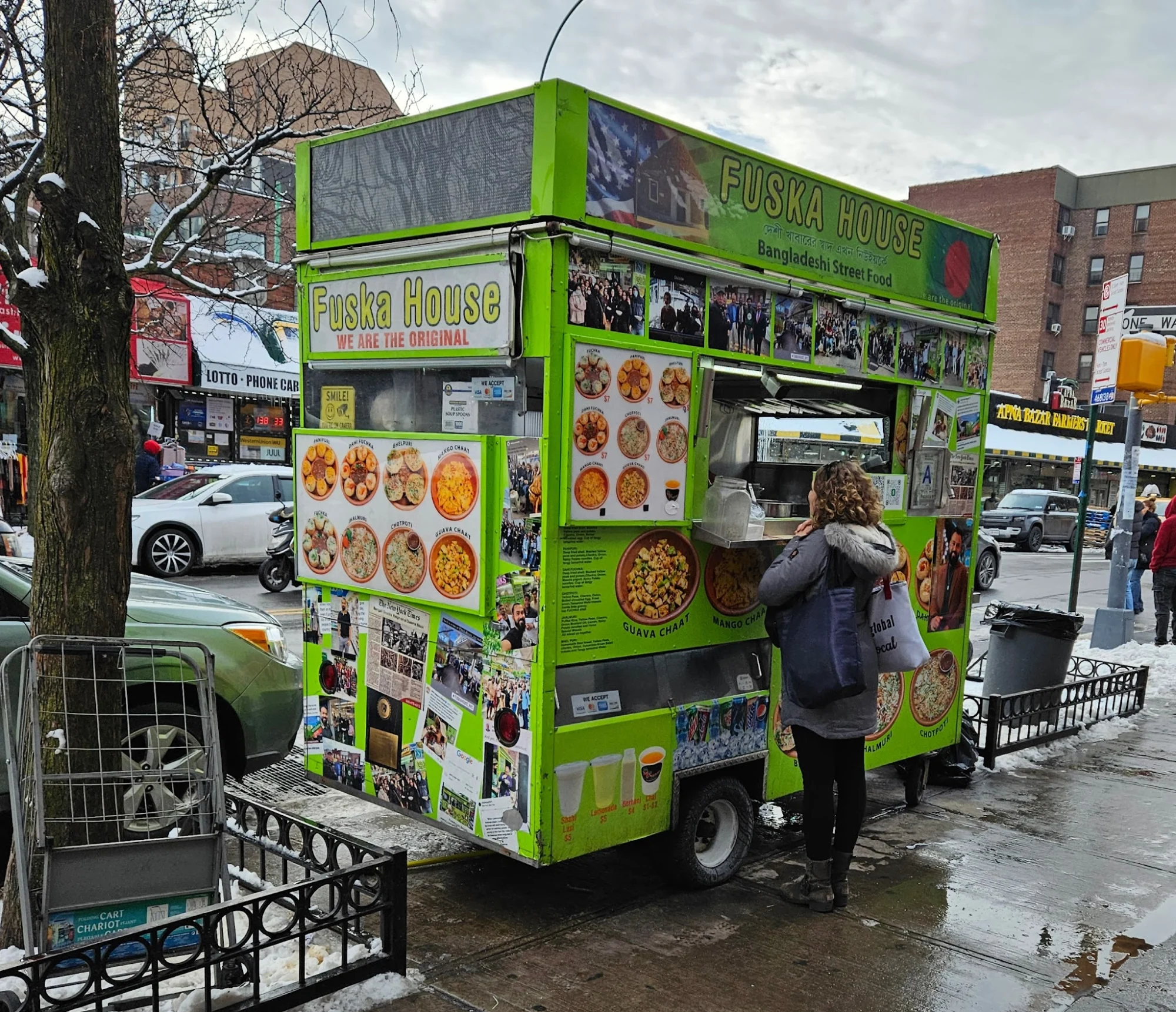 Food cart called 'Fuska House' with Bangladeshi street food graphics in Jackson Heights, Queens.