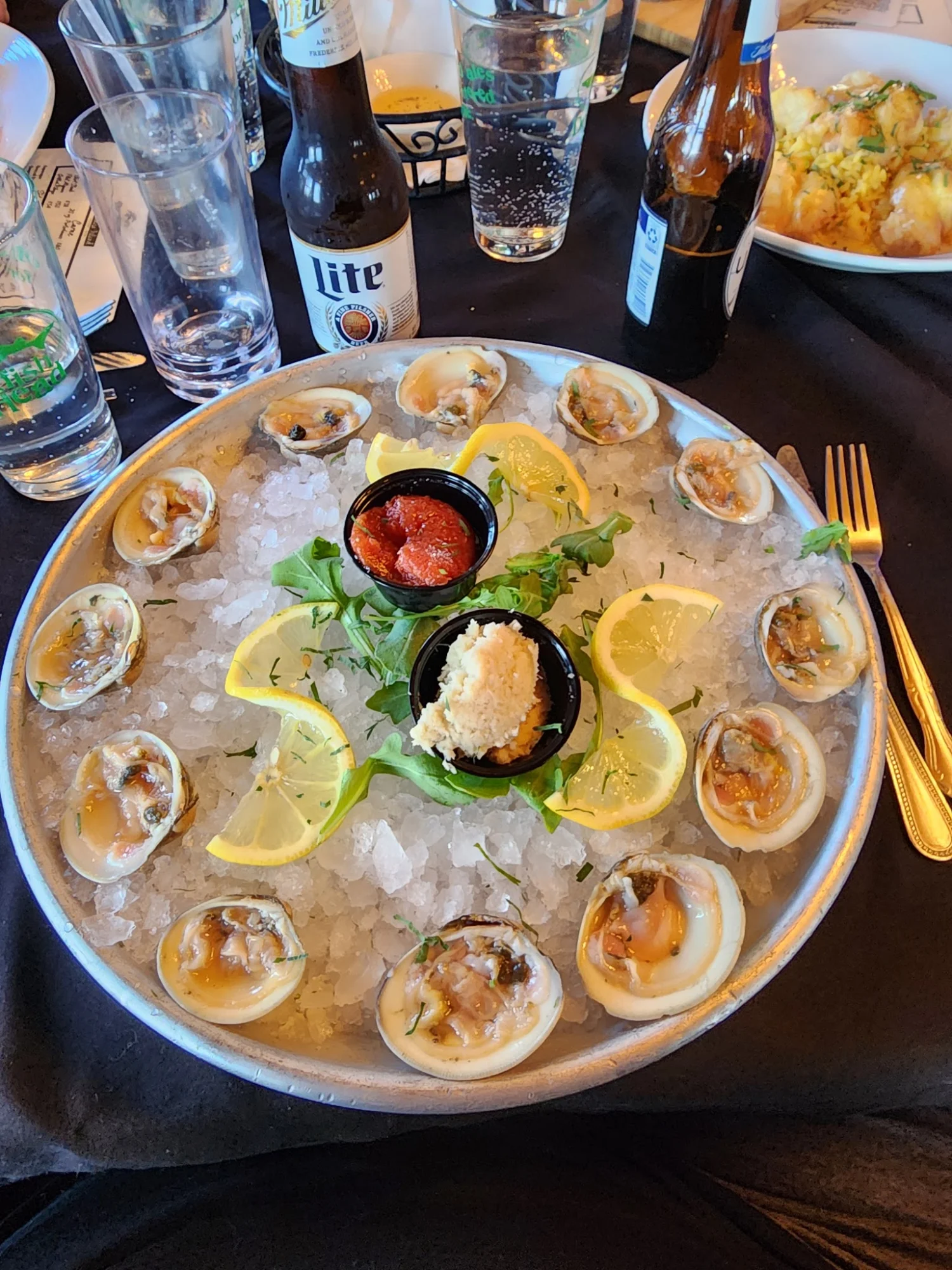 Plate of clams on ice with lemon slices, cocktail sauce, horseradish at Paradise Island, Tottenville.