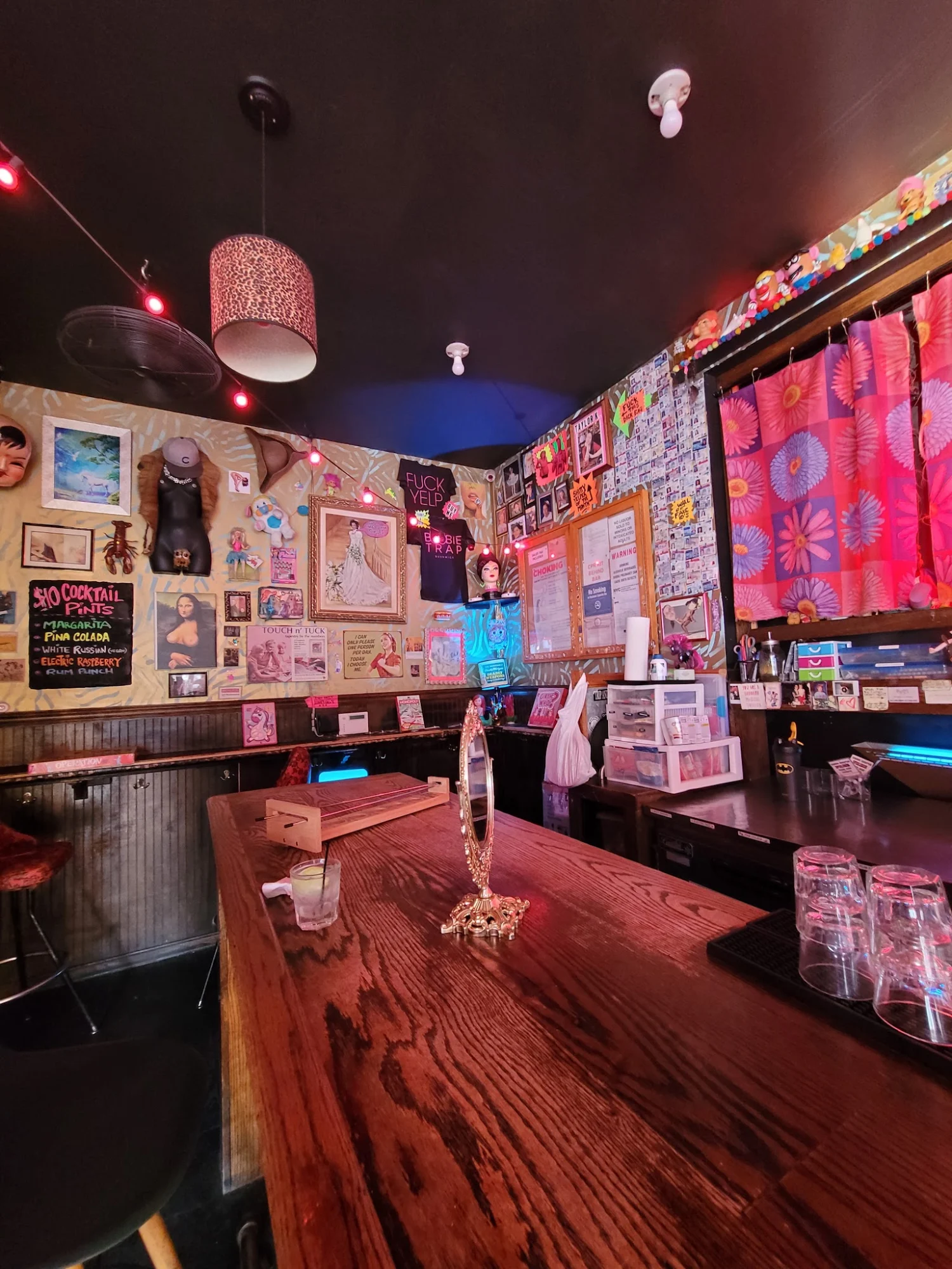 Boobie Trap featured image Interior of Boobie Trap in Bushwick with eclectic decor and bar seating.