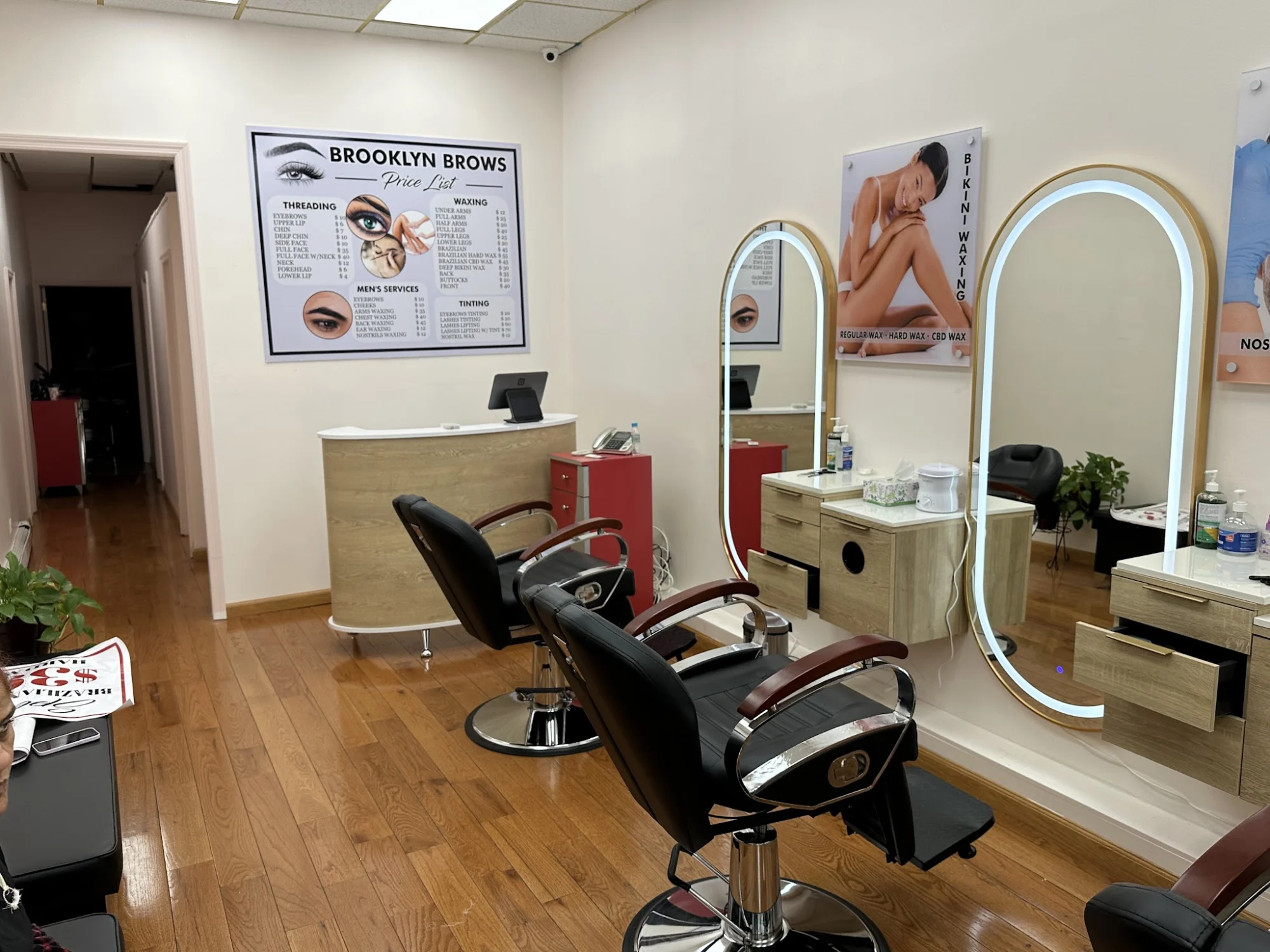 Brooklyn Brows Threading Salon in Brooklyn, NY featured image Interior of Brooklyn Brows Threading Salon with mirrors and chairs, Cobble Hill.