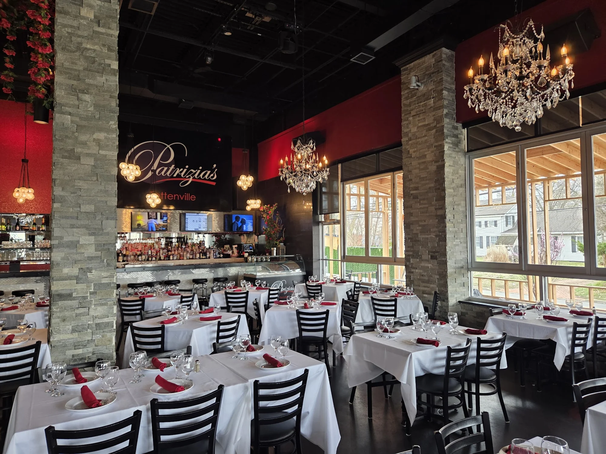 Patrizia's Of Tottenville featured image Interior of Patrizia's Of Tottenville with tables set with white cloths and chandeliers, Tottenville.
