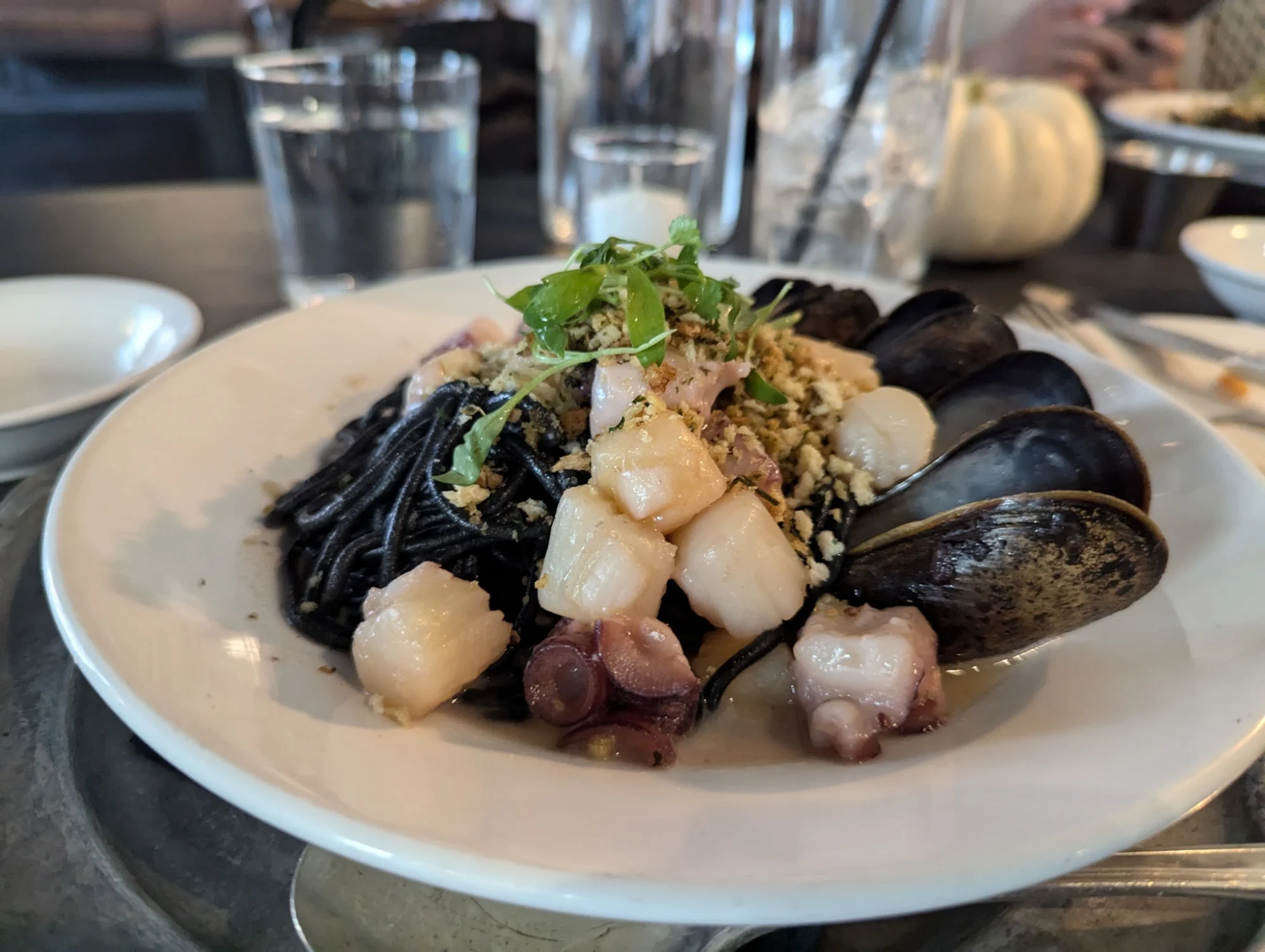 Plate of pasta with mussels, scallops, and herbs at Vinatería, Harlem.