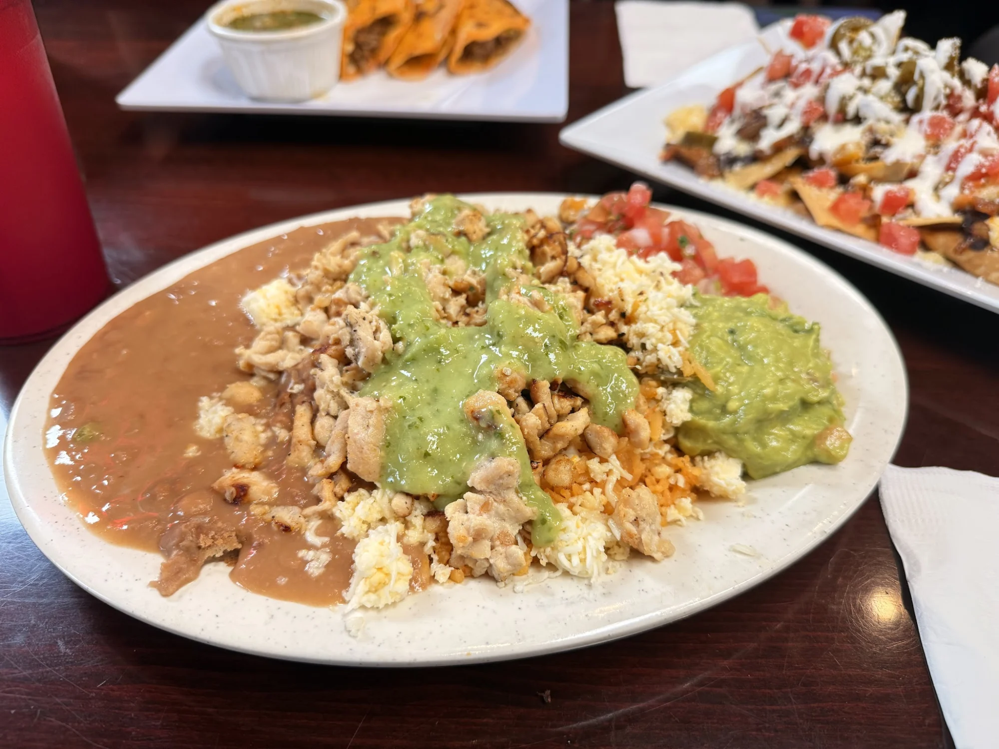 Plate with rice, beans, chicken, and guacamole at Cinco de Mayo, Sunset Park.