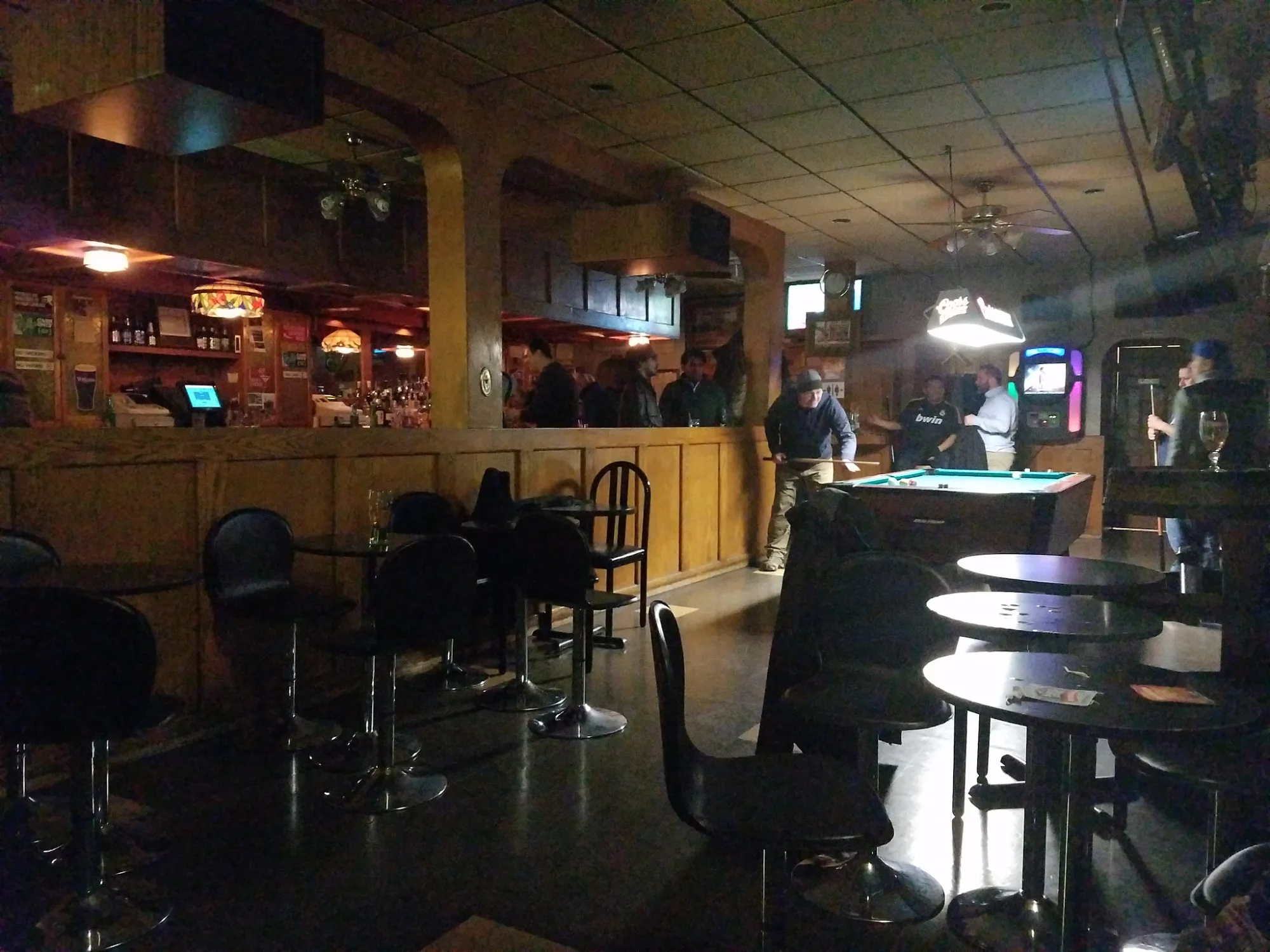 Interior of Ready Penny Inn, Jackson Heights with bar area and patrons.