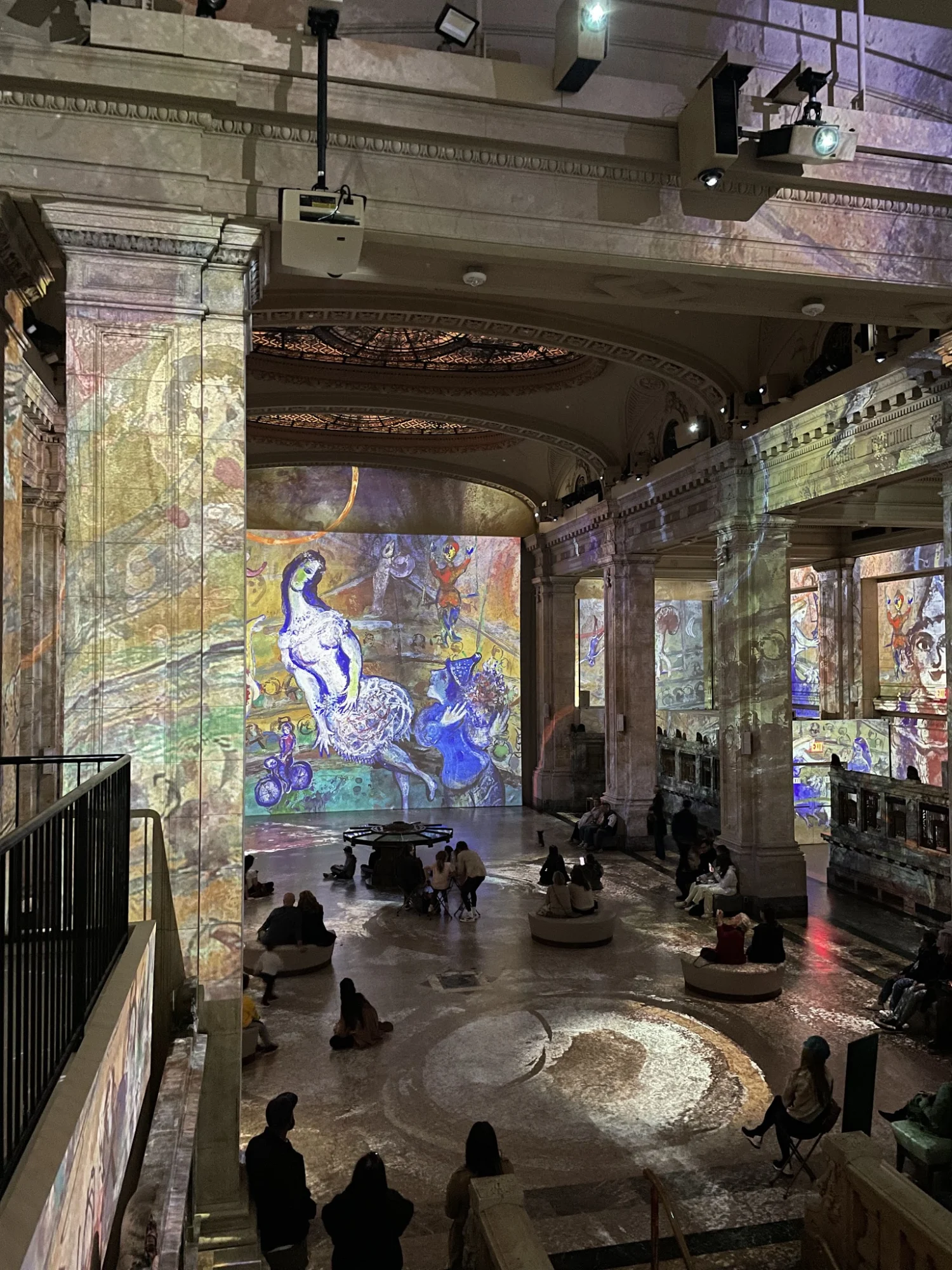 Hall des Lumières featured image Projection of colorful art on walls and floor inside Hall des Lumières, Civic Center, Bronx NYC.