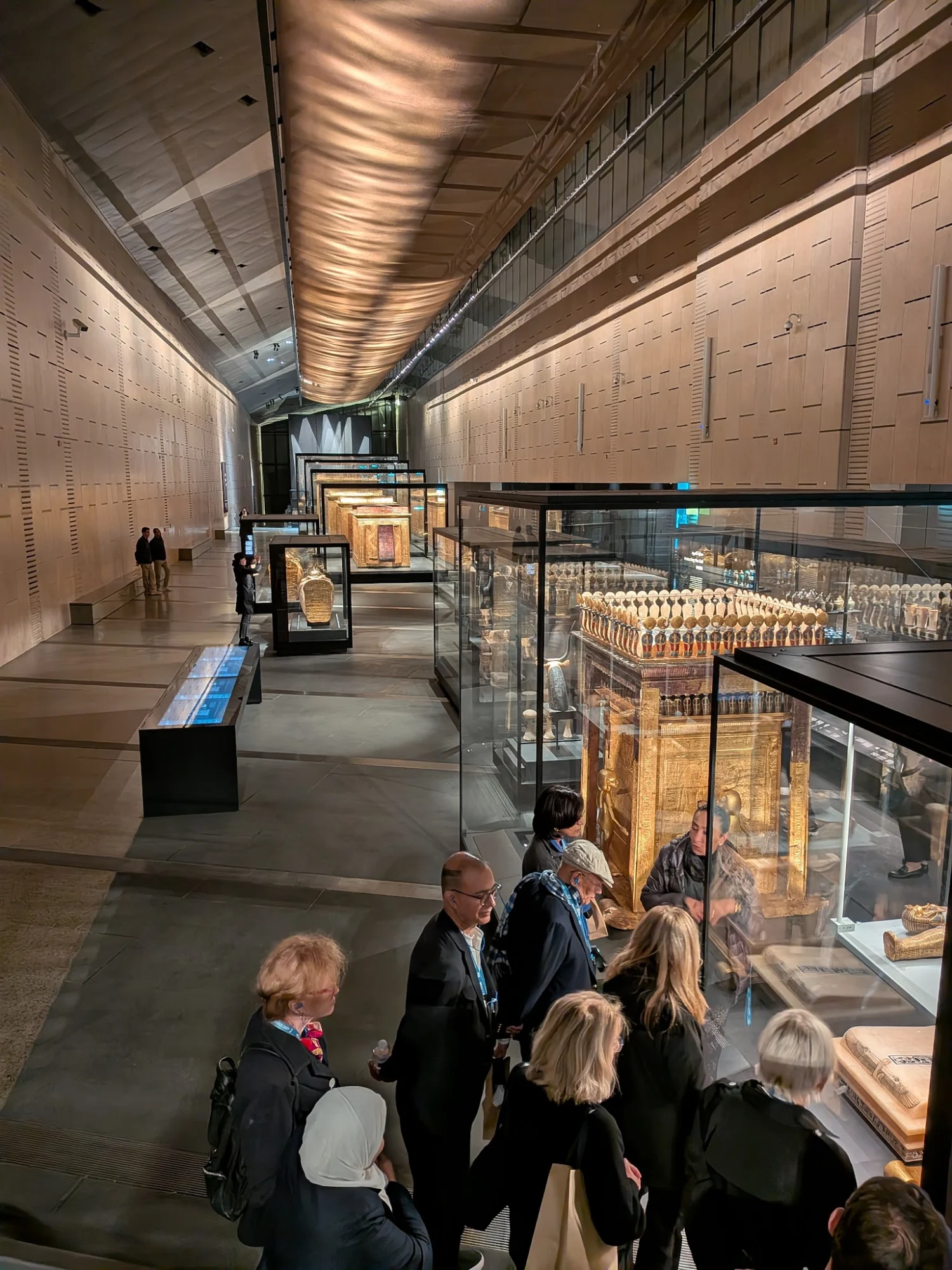Arrangements Abroad Inc featured image Interior of an exhibition hall in Arrangements Abroad Inc, Garment District, Bronx NYC. Visitors viewing displayed artifacts.